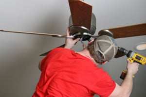 Man installing a ceiling fan
